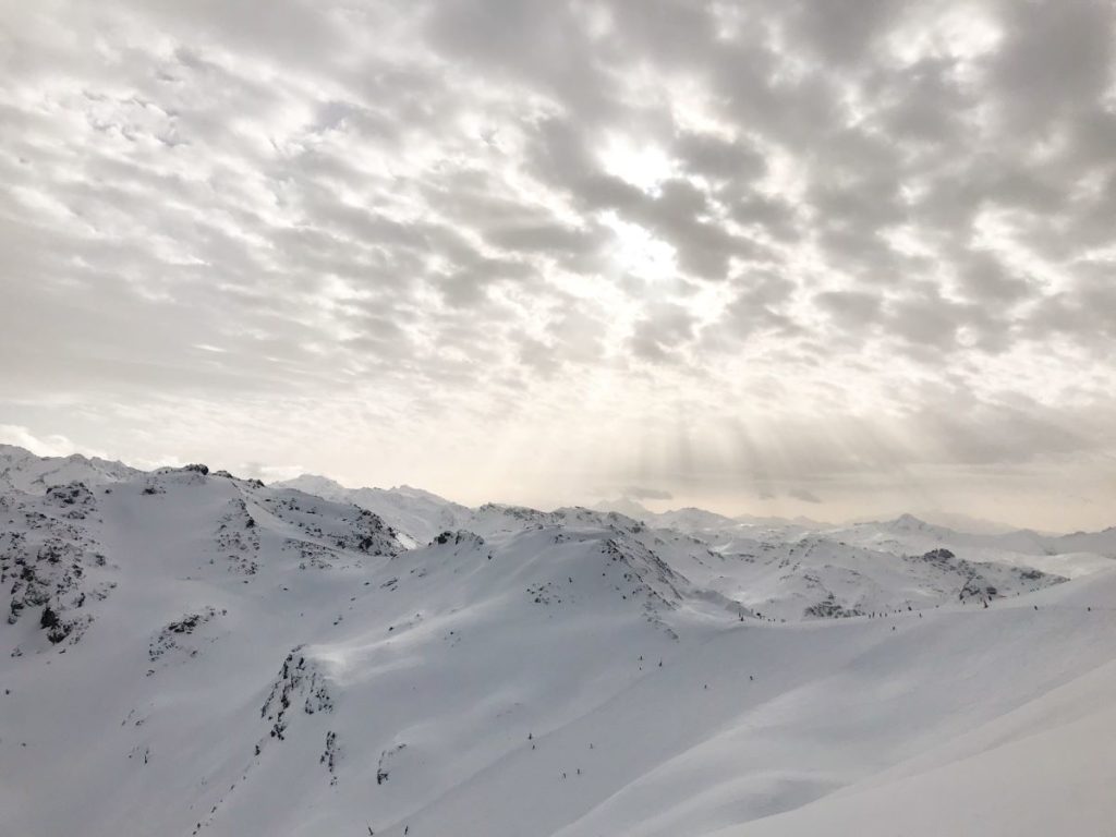 Beautiful sun rays while skiing in the French Alps